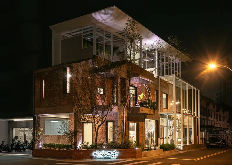The concept store lit up at night
