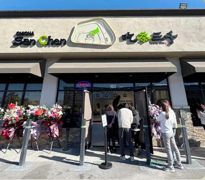 Guests lining up outside a new Chi Cha San Chen store on opening day